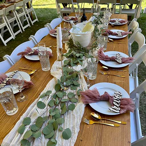 Paper Unicorn table runner at outdoor wedding