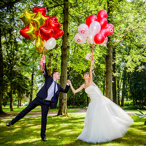 Couple of bride and groom with balloons